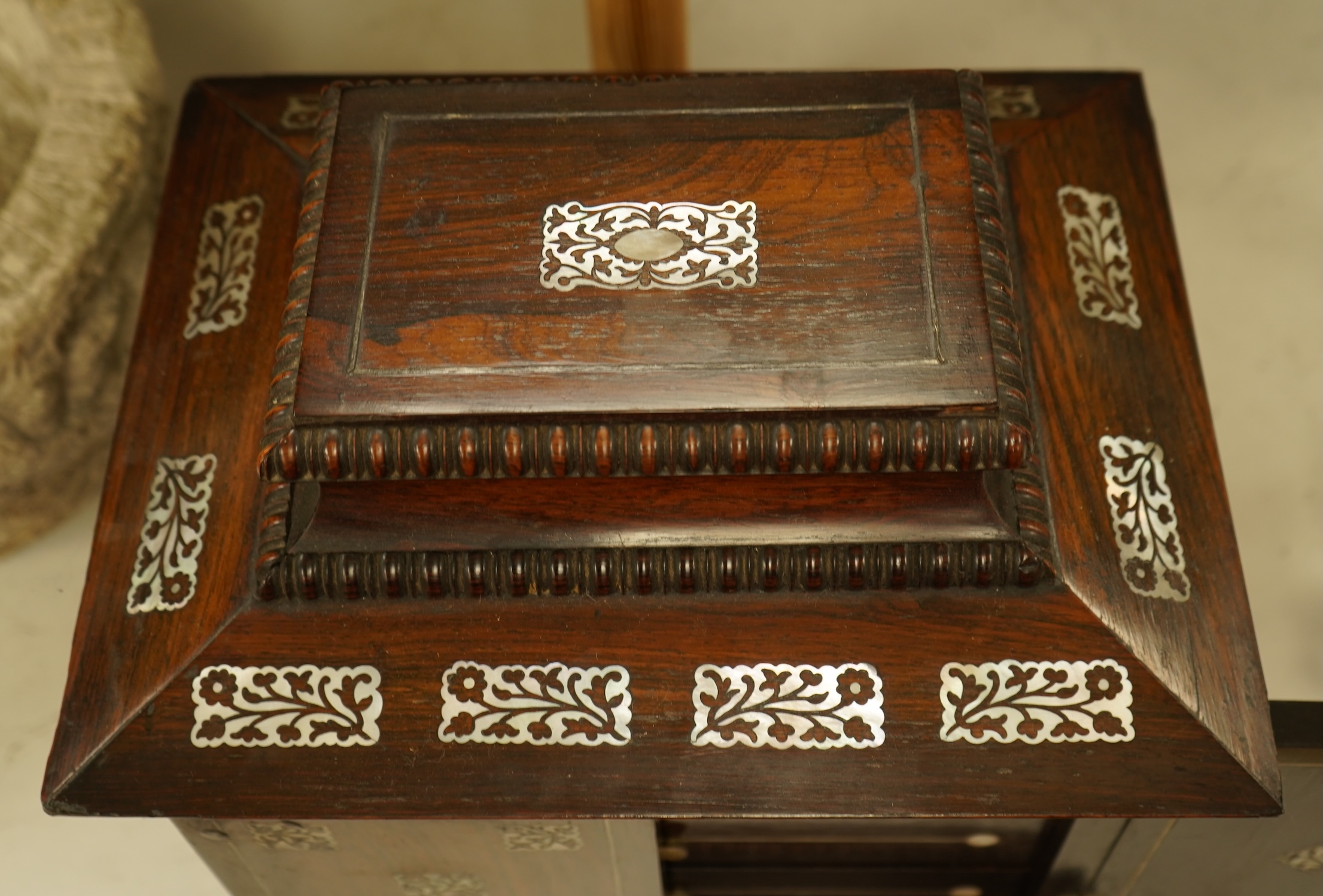 A William IV rosewood and mother of pearl inlaid sewing and writing cabinet with tooled Moroccan leather fitted interior, 37cm high